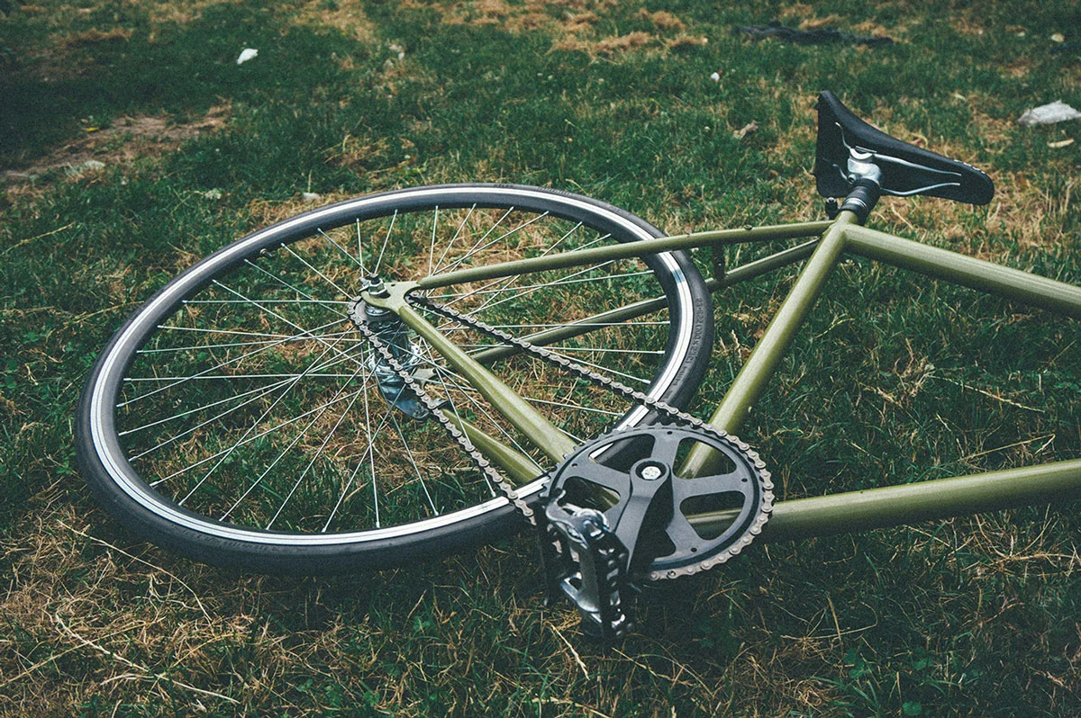 greenbike laying on grass